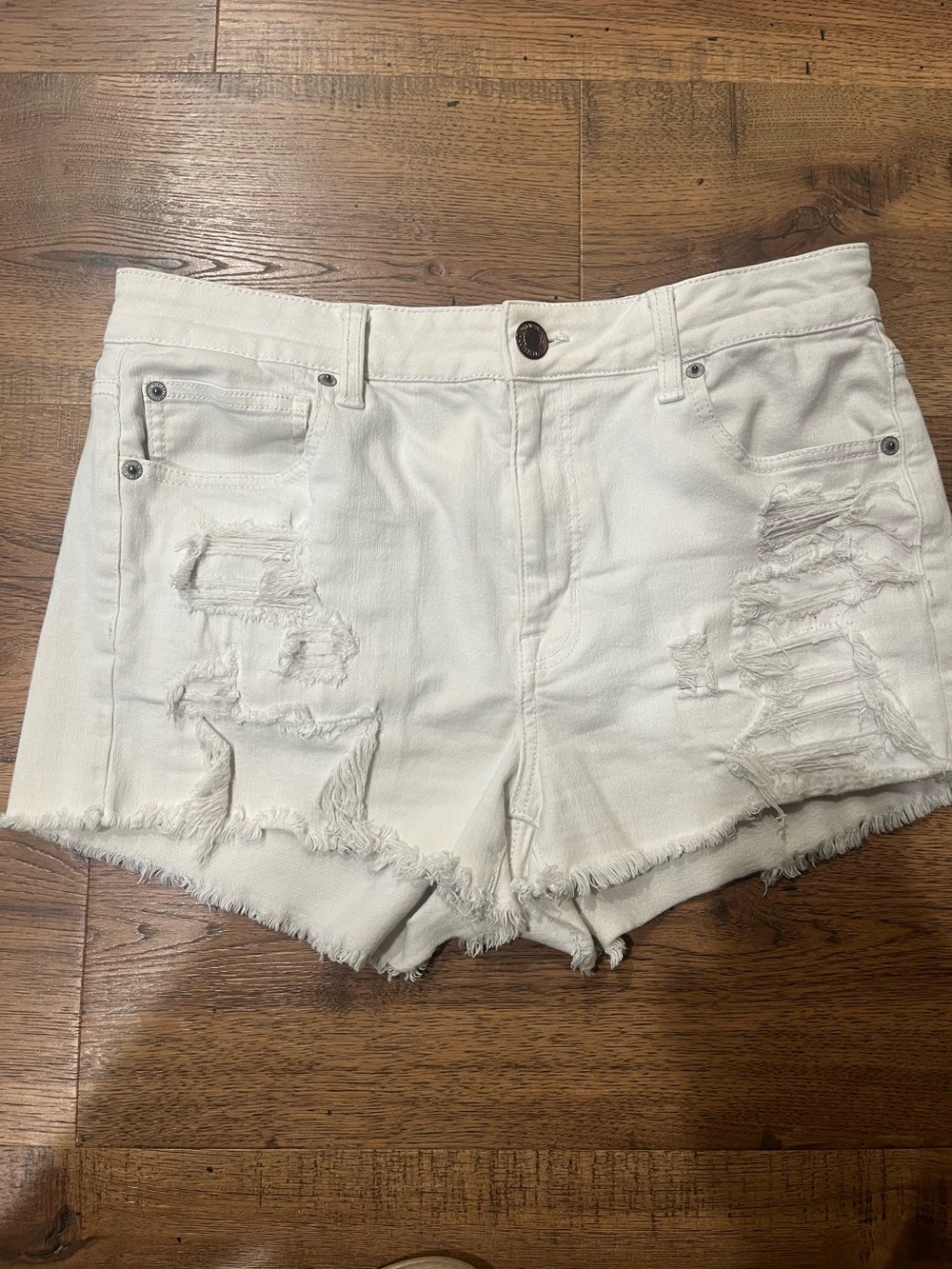 American Eagle Outfitters White Distressed Denim Cutoff Shorts size 12 stretch